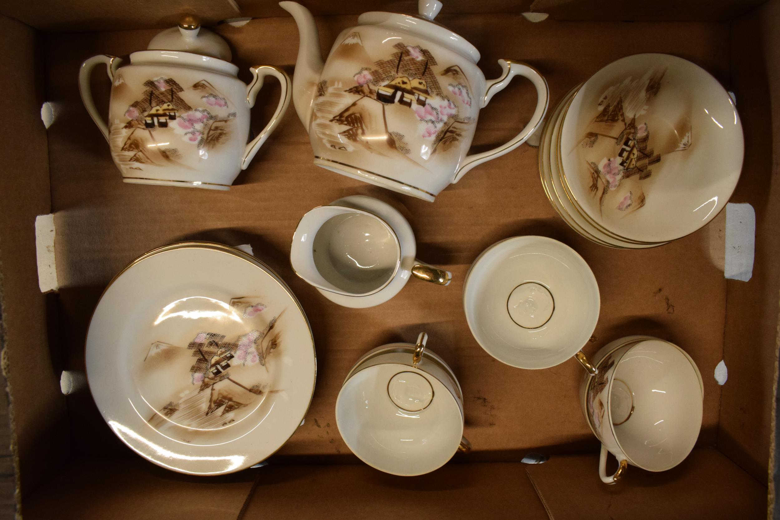 A handpainted Hayasi China tea set in the Kutani pattern to include a teapot, milk and sugar