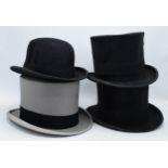 A collection of top hats to include Hyam and Co of Birmingham, a Rowans example (grey with carry