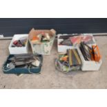 A large collection of Scalextrics and similar toys to include track, features etc in used condition.