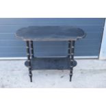 An early 20th century ebonised side table with brass beading. 92 x 48 x 70cm. In good functional