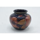 Moorcroft small squat vase in the Pomegranate design. 7cm tall. In good condition with no obvious