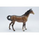 Beswick early brown Swishtail horse 1182 with 2 holes to underside of belly. In good condition