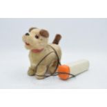 A mid to late 20th century toy in the form of a remote controlled dog, battery operated, made by