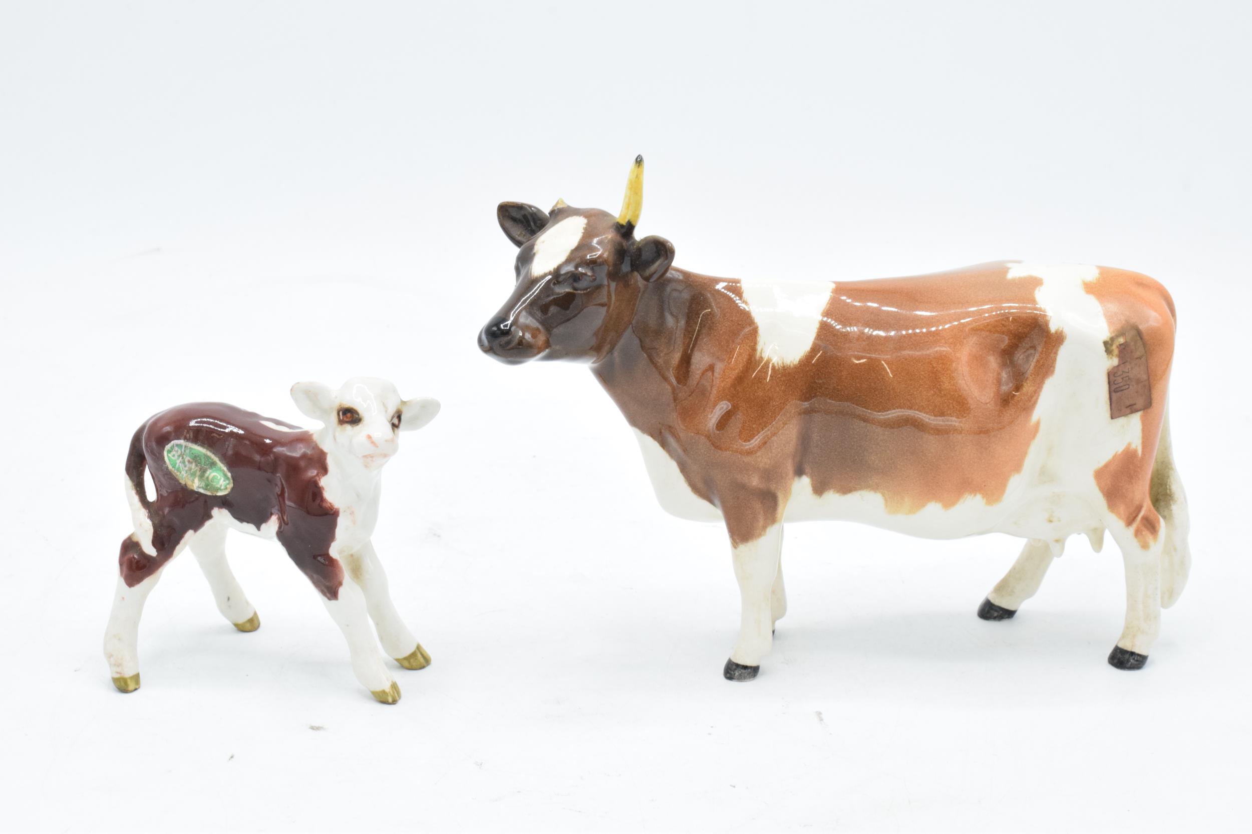 Beswick Hereford Calf 1406B together with Ayshire Cow Ch Ickham Bessie 1350 af (2). In good