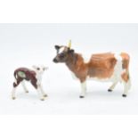 Beswick Hereford Calf 1406B together with Ayshire Cow Ch Ickham Bessie 1350 af (2). In good