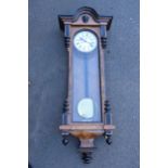 A large quality 19th century burr walnut 8 day double-weight Vienna wall clock with carved