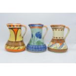 A collection of Myott Son and Co Art Deco jugs depicting various designs (3). 19cm tall. Generally