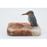 A 20th century painted metal kingfisher mounted onto an alabaster or similar base in the form of a