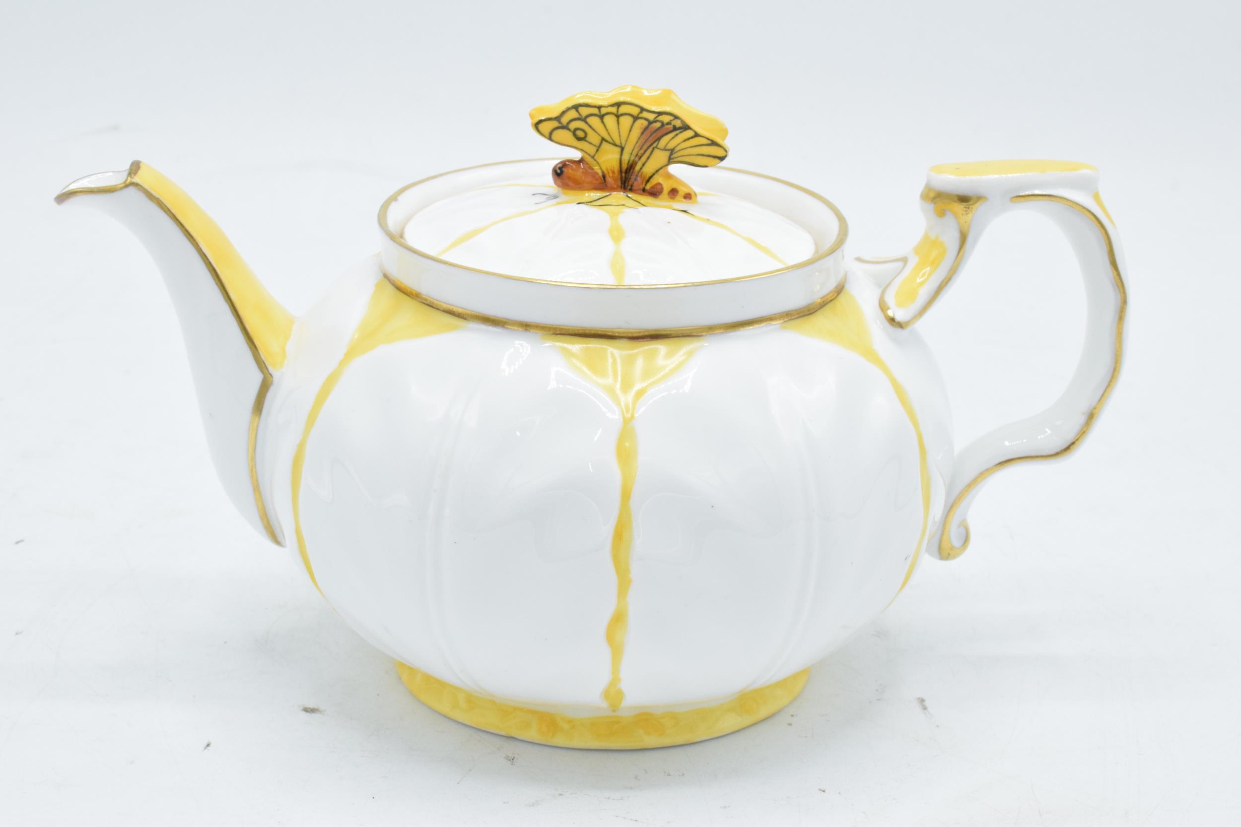 Aynsley yellow leaf moulded teapot with a butterfly finial on the teapot lid. 10cm tall. In good