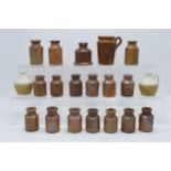 A collection of miniature stoneware jars and similar. All unmarked. Largest 9.5cm tall. Generally in