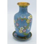A 20th century Japanese cloisonné vase and matching stand decorated with a floral design on a blue