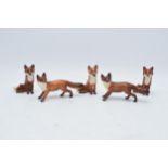A collection of Beswick foxes to include standing fox 1440 x 2 and seated fox 1748 x 3 (5) with some