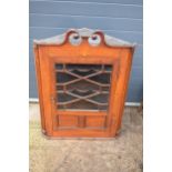 A 19th century inlaid corner cabinet with astragal glazed door with swan neck pediment. 106cm