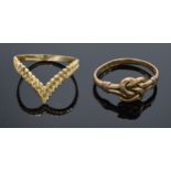 A pair of 9ct gold ladies rings. 2.4 grams. One with Celtic style design.