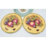 A pair of Aynsley Orchard Gold 26.5cm diameter plates signed by D. Jones together with an Aynsley