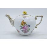 Herend Porcelain teapot with raised flower finial and dragon spout decorated with floral scenes.