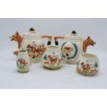 A Portland Pottery tea set showing traditional hunting scenes to consist of 2 teapots, milk, sugar