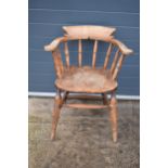 A late 19th century elm or similar Captains bow back arm chair. 79cm tall. In good condition with