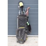 A collection of golf clubs in a Maxfli golfing bag with brands to include Wilson, Hippo etc. Will