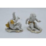 A pair of Rudolph Kammer pottery figures of dancing cherubs with gilt highlights. In good