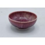 Ruskin miniature high fired bowl in a red/ maroon / purple fusion of colours. 6cm diameter.