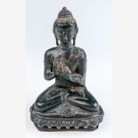 Kleine Figur eines sitzenden Buddha Tibet