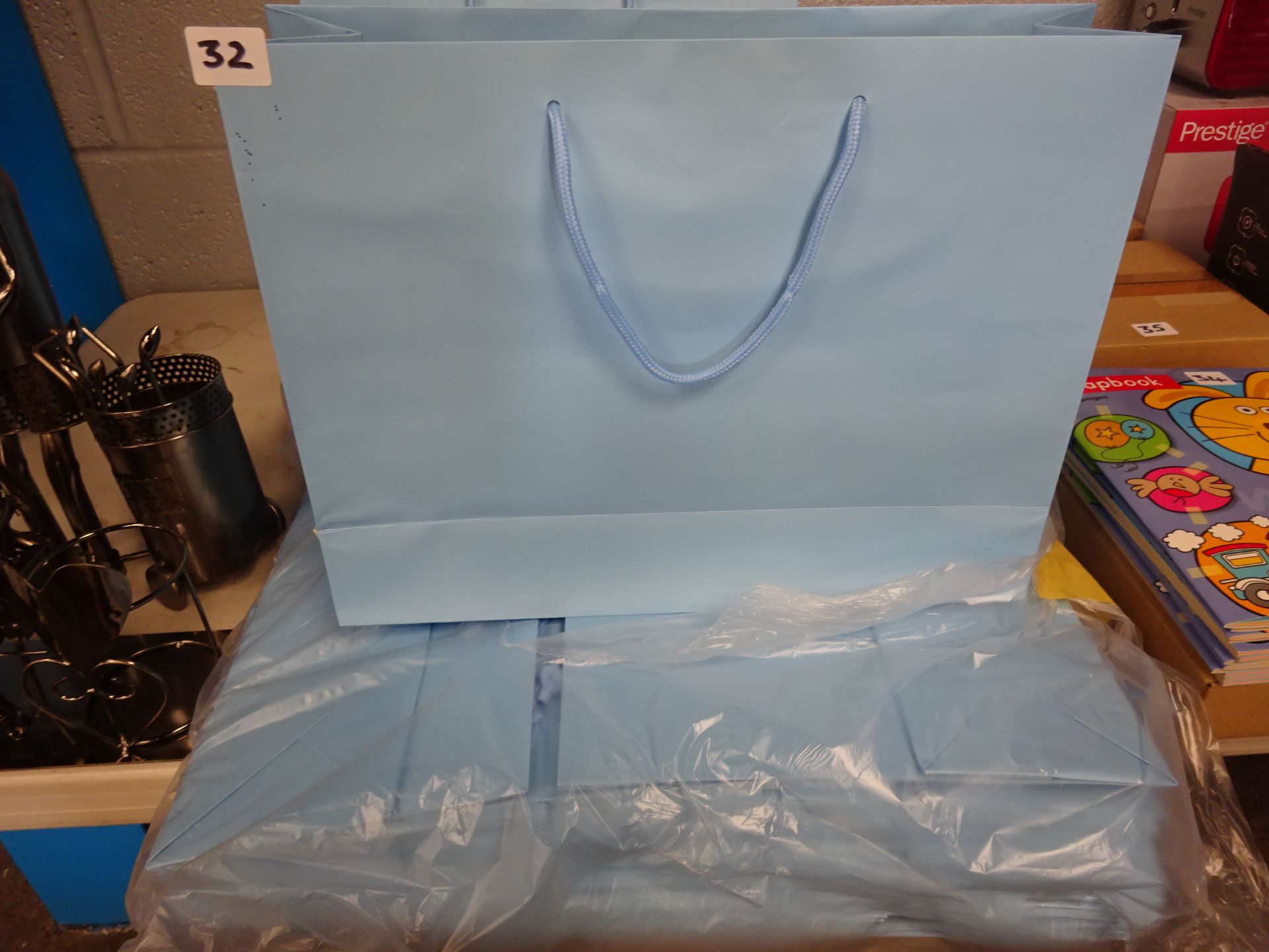 QTY OF LG BLUE GIFT BAGS APPROX 50