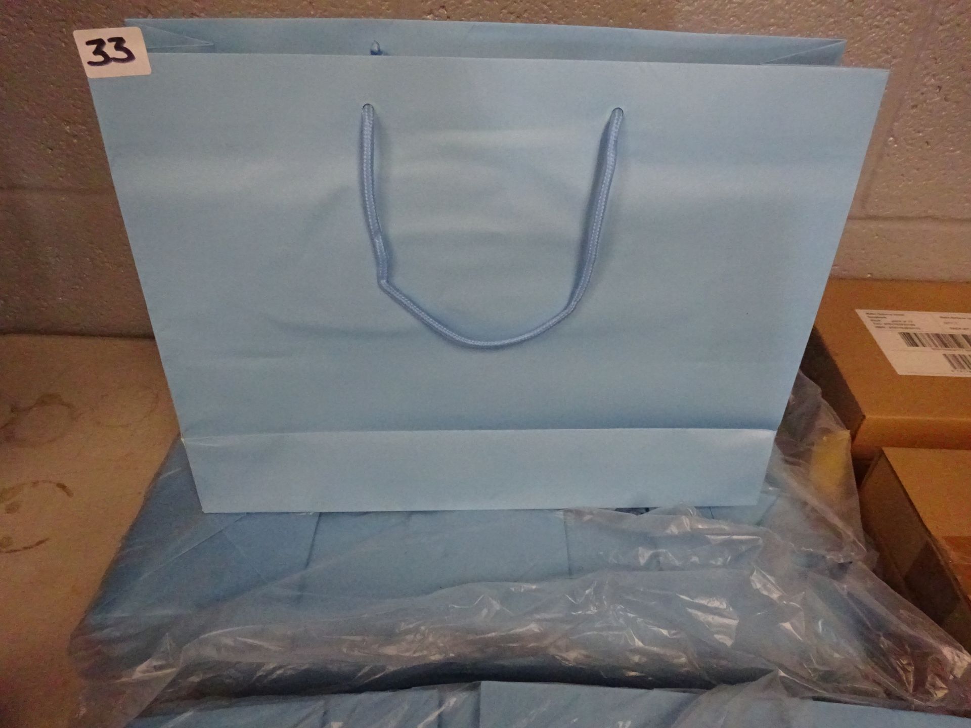 QTY OF LG BLUE GIFT BAGS APPROX 50