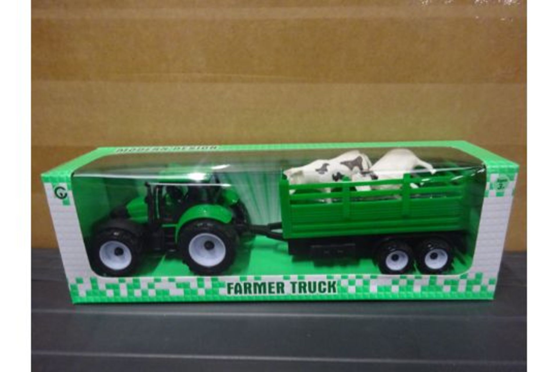 Green Tractor With Stock Trailer Including A Cow And A Sheep