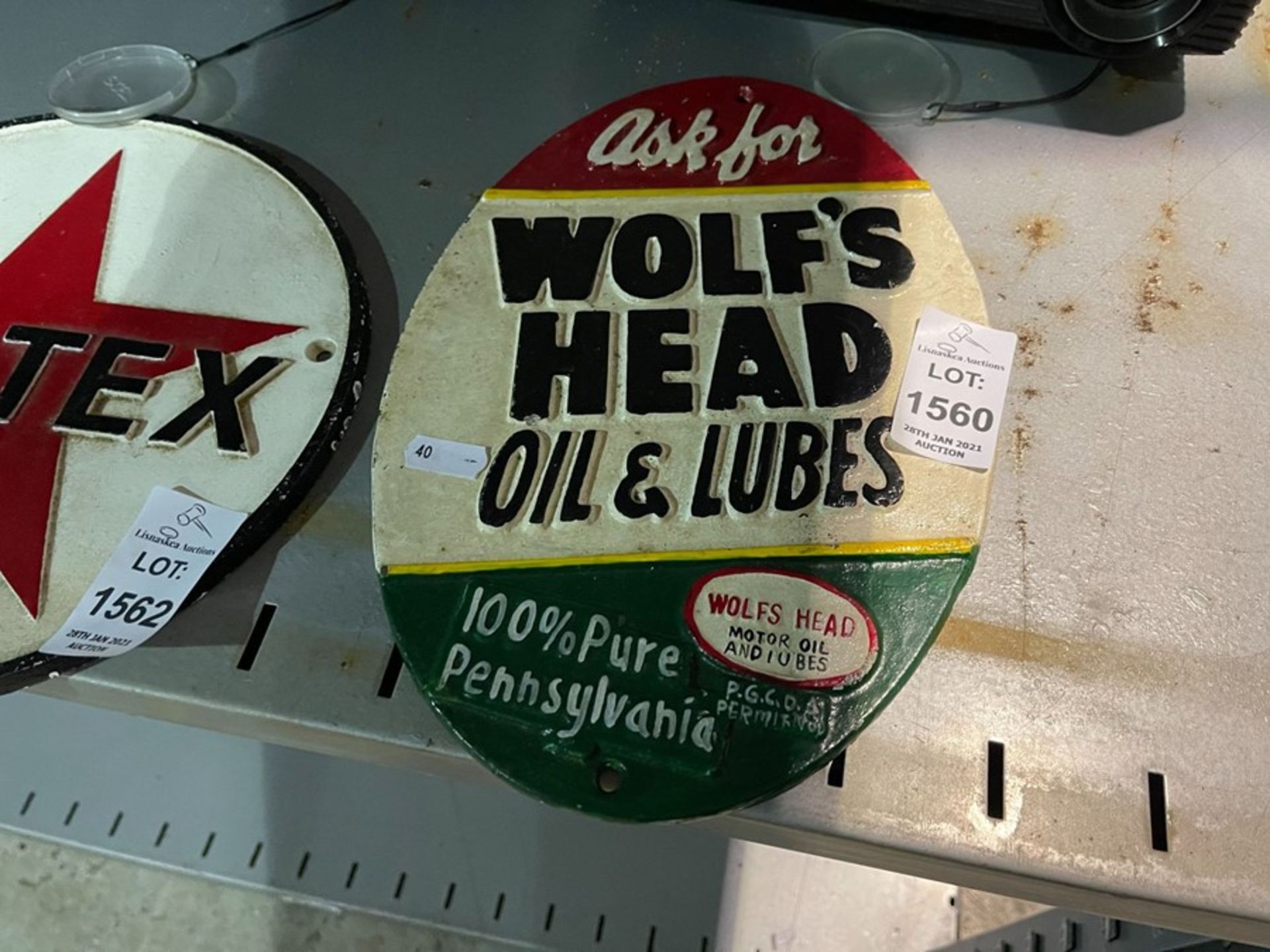 WOLF'S HEAD OIL & LUBES CAST IRON PLAQUE