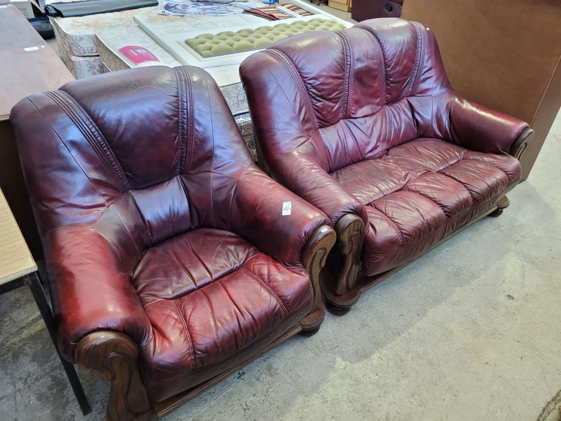 RED LEATHER 2 SEATER SETTEE AND ARMCHAIR (SMALL TEAR ON SETTEE SEAT)