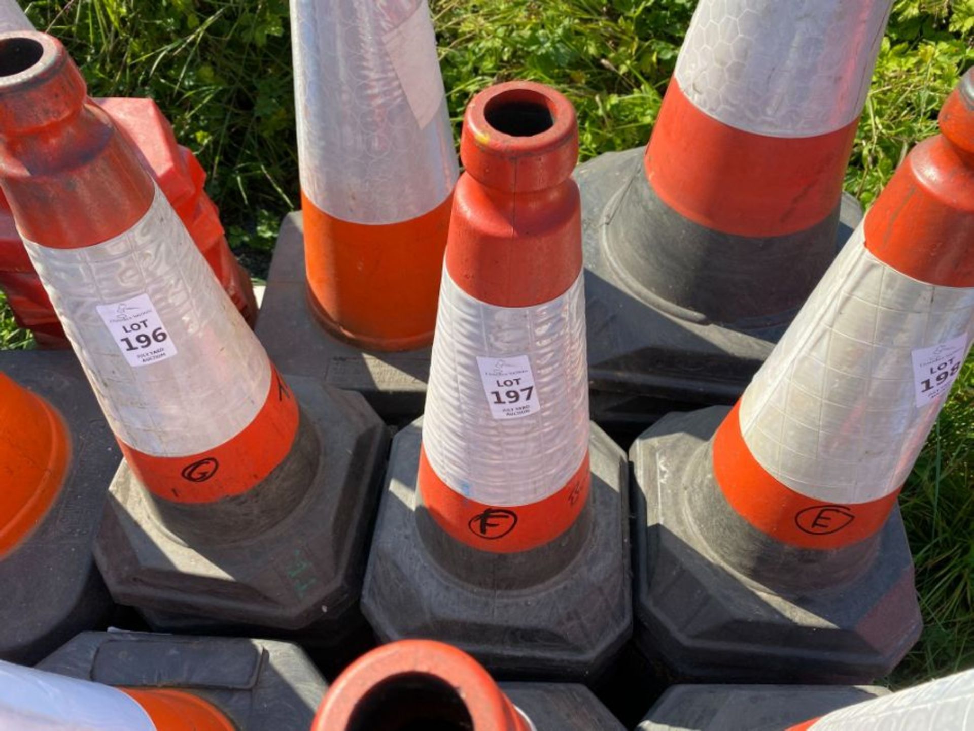 STACK OF TRAFFIC CONES (F) (HAMMER VAT ON THIS ITEM)