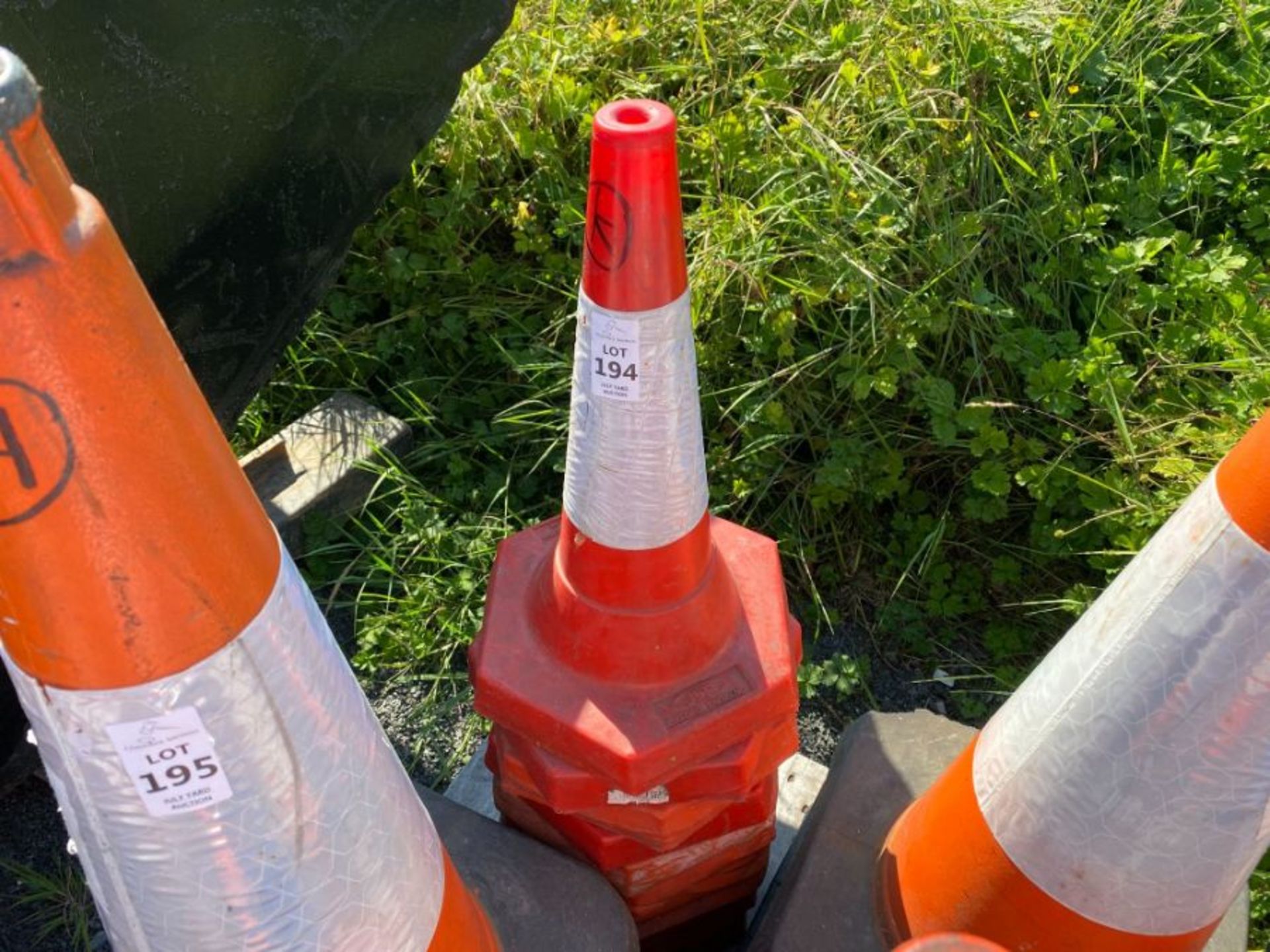 STACK OF TRAFFIC CONES (K) (HAMMER VAT ON THIS ITEM)