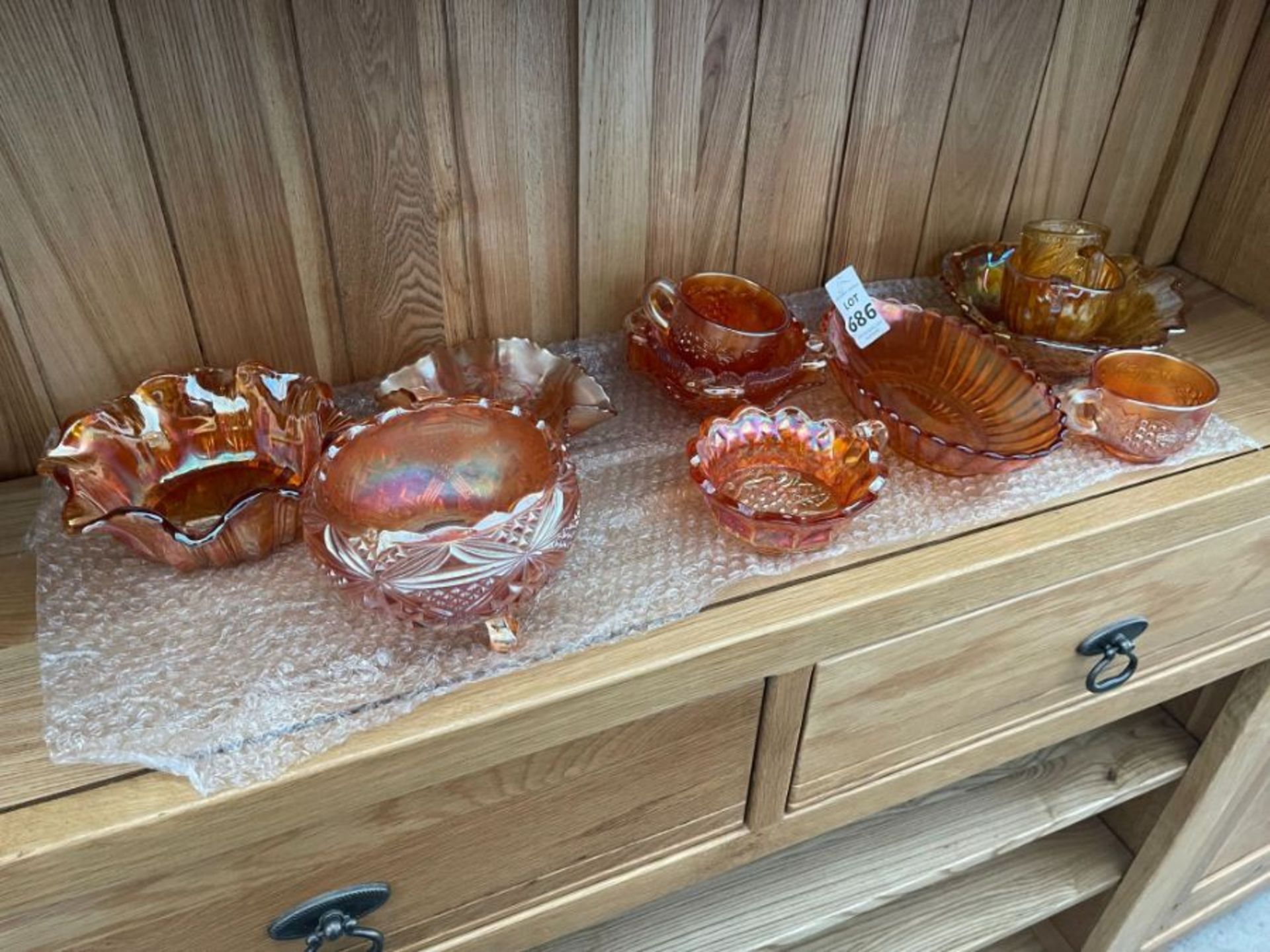 SHELF OF ORANGE LUSTRE WARE