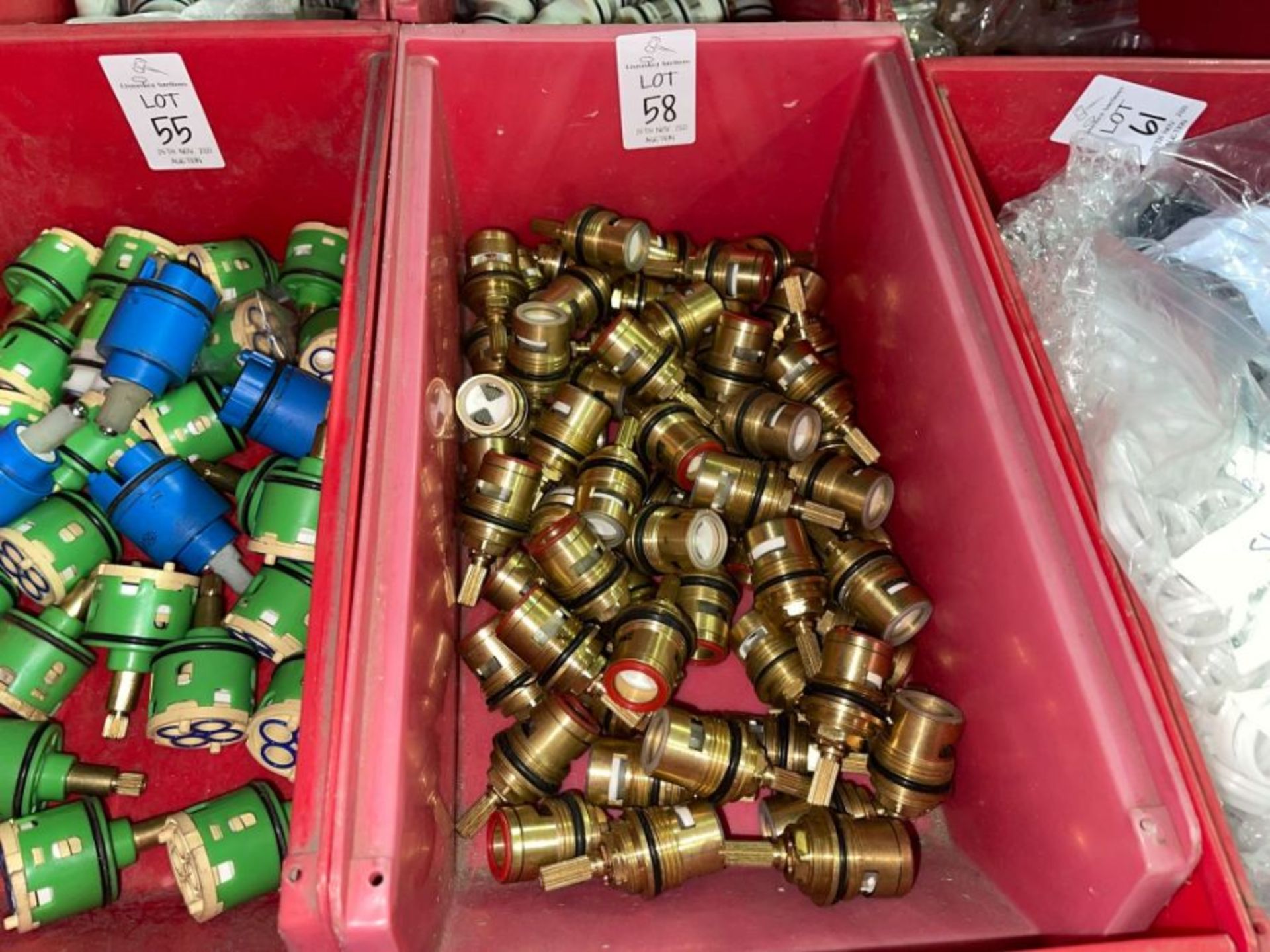RED TUB OF BRASS FITTINGS