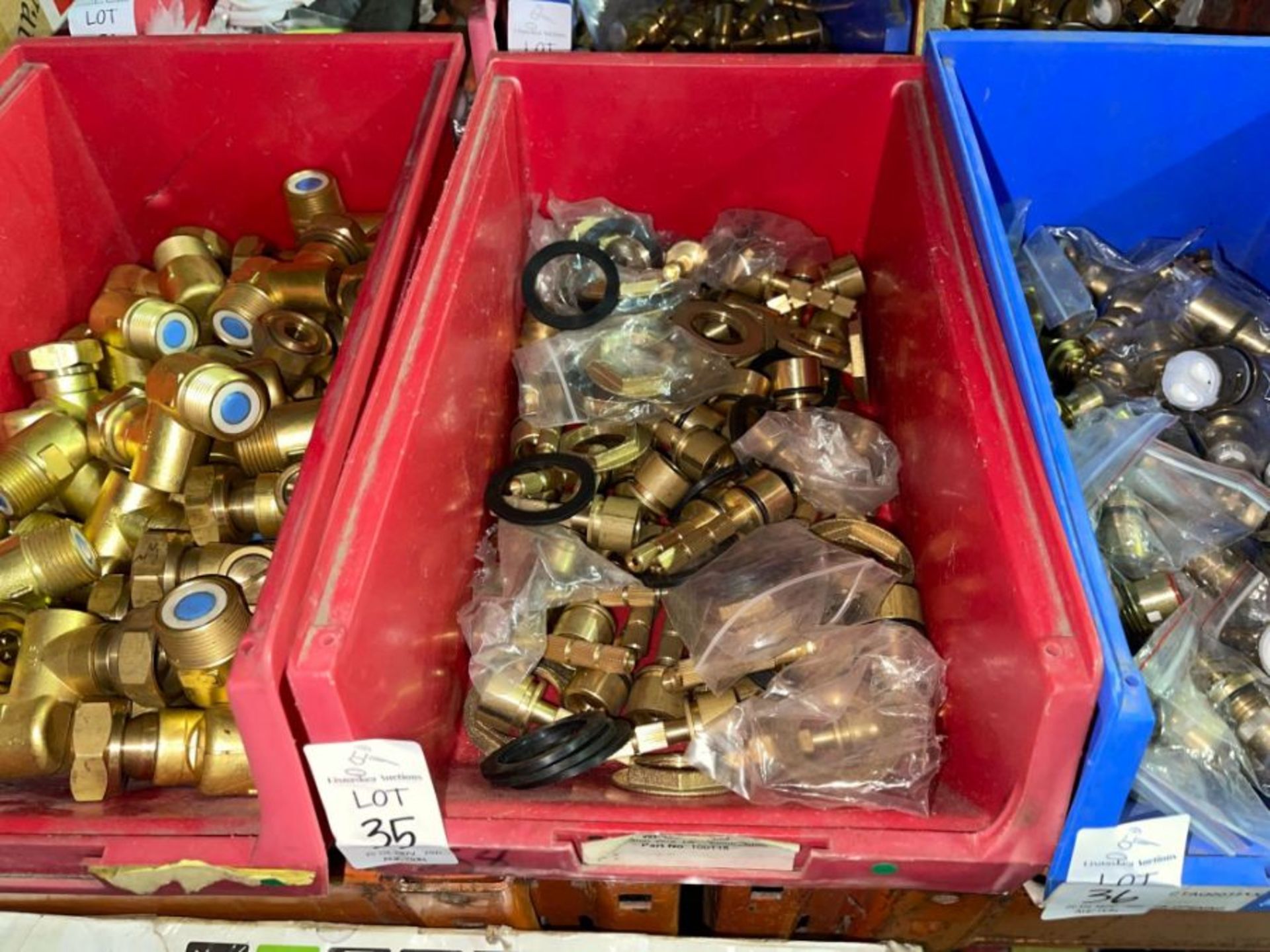 RED TUB OF BRASS FITTINGS