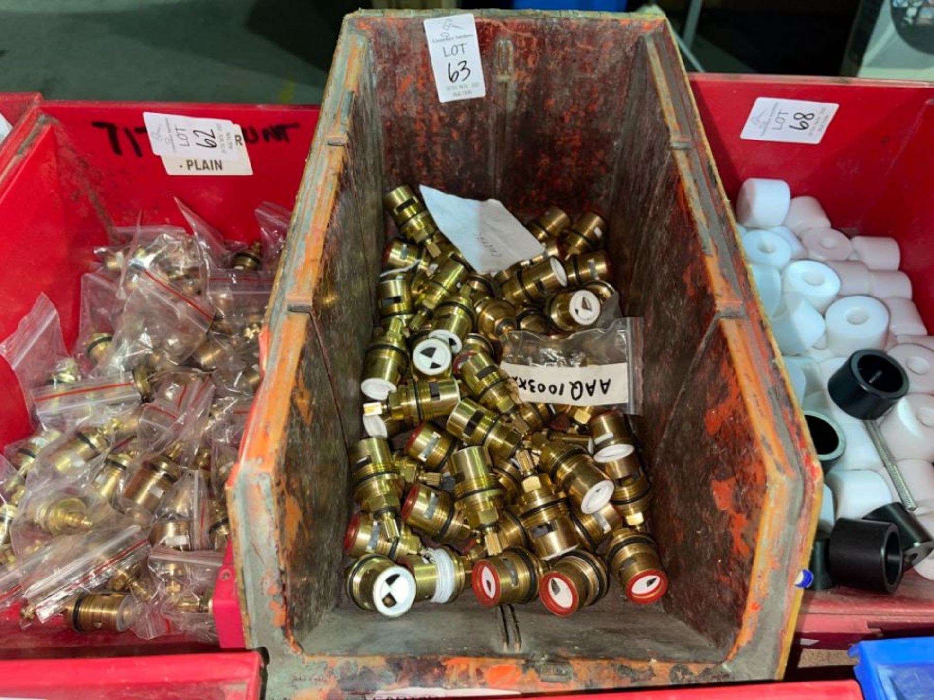 RED TUB OF BRASS FITTINGS