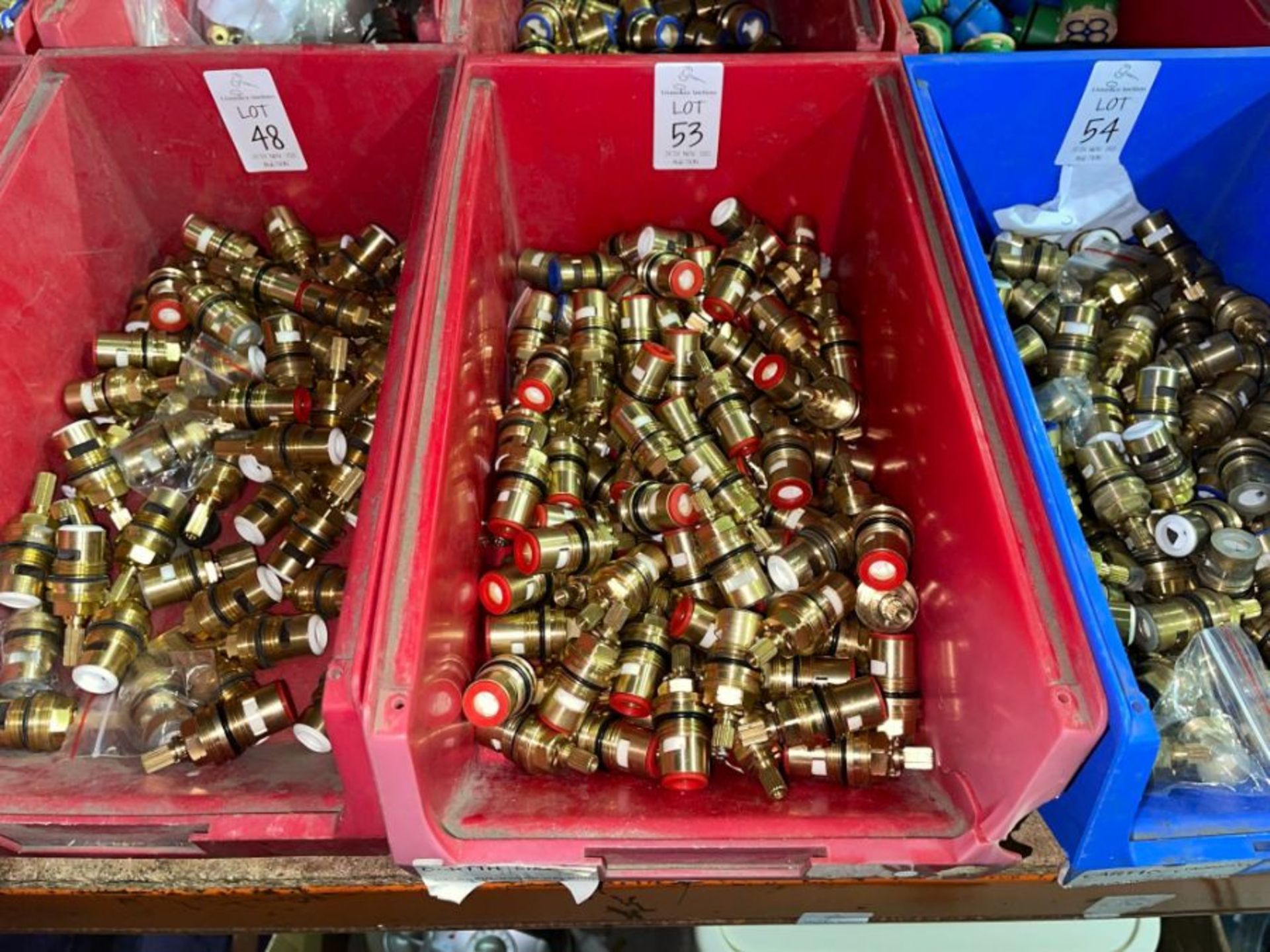 RED TUB OF BRASS FITTINGS