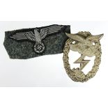German Nazi cloth eagle sleeve badge ?, and a Luftwaffe Ground Assault badge. (2)