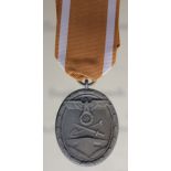 German West Wall medal in packet with award document to Unterroffizier August Follmer dated 30-3-