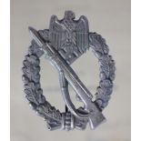 German Infantry Assault War badge in silver with award document to Unteroffizier helmet Fischer