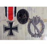 German Iron Cross 2nd class with wound badge in black and Infantry Assault War badge in silver all