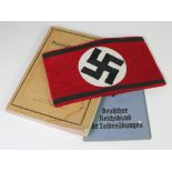 German NSDAP party arm band with German Reichsbund booklet with one other German manual