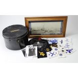Navy Hat Tin, Navy Beret with badge, selection of cloth insignia and a picture of HMS Shakespear. (
