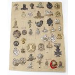 Cap Badges - display card of military badges (approx 44)