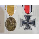 German Iron Cross 2nd class and West Wall medal with award documents to Unteroffizier Valentin