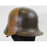 Imperial German Stalhelm steel helmet with Camo paint finish, complete with liner.