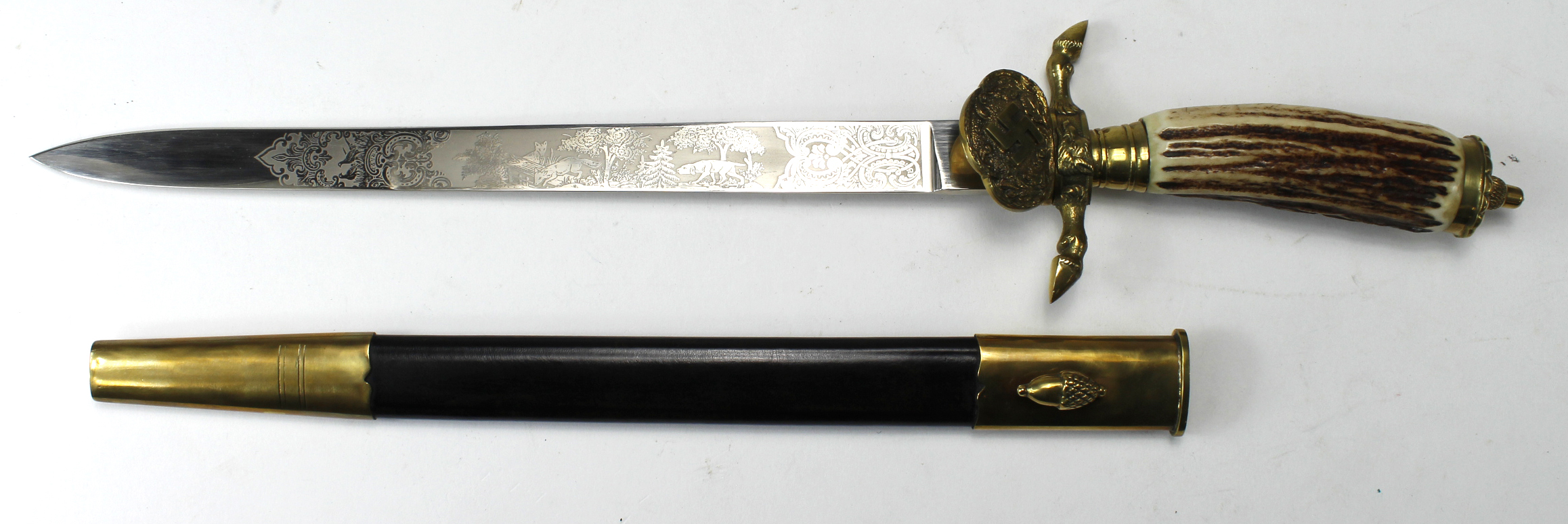 German Nazi Hunting Cutlass, with etched blade and swastika cast into brass clamshell. Hunting