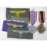 German War Merit cross 2nd class with Luftschutz medal and four German cloth breast eagles