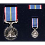 National Service Medal in fitted case with matching miniature and medal bar